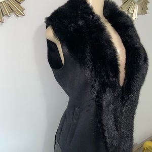This fashionable fur vest compliments any outfit! Size small